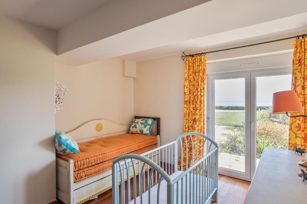 Posteľ alebo postele v izbe v ubytovaní L'Ambassadeur - Magnifique appartement dans l'ancien hôtel Ar Vro