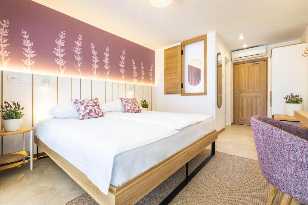 Postel nebo postele na pokoji v ubytování Hotel Vile Park Premium