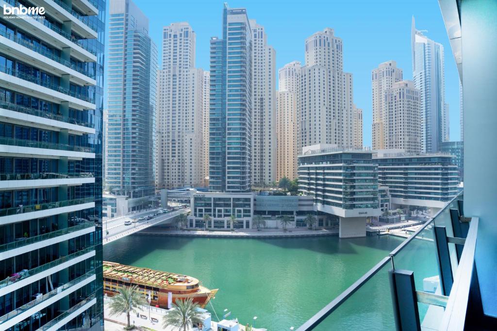 a view of a city with tall buildings and a river at bnbme homes - Classic Studio Heart of the Marina - 808 in Dubai