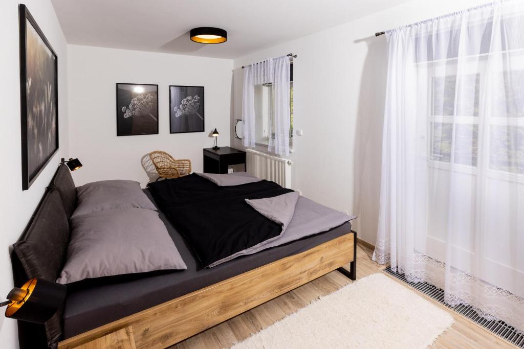 Postel nebo postele na pokoji v ubytování Apartmán 21 Hubertus