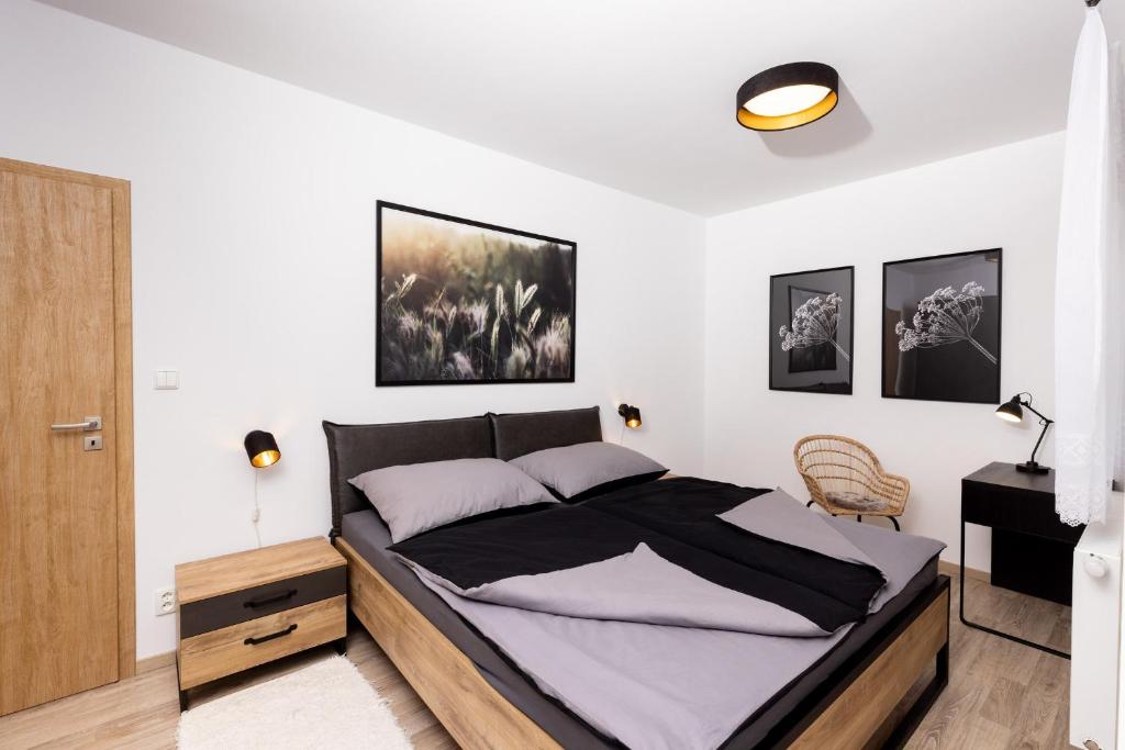 Postel nebo postele na pokoji v ubytování Apartmán 21 Hubertus