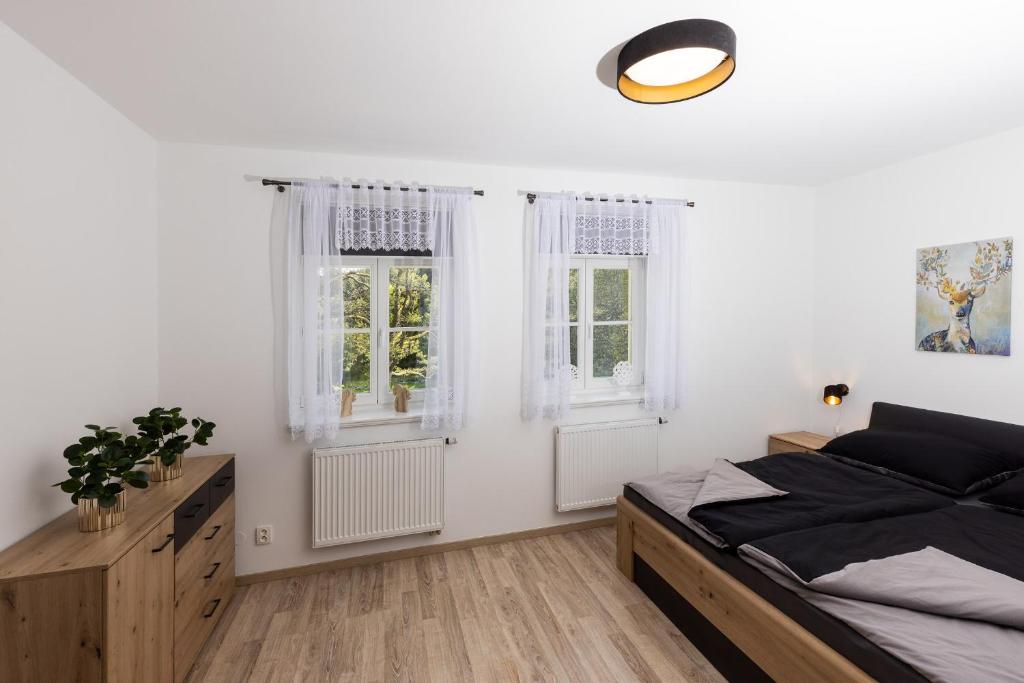 Postel nebo postele na pokoji v ubytování Apartmán 21 Hubertus