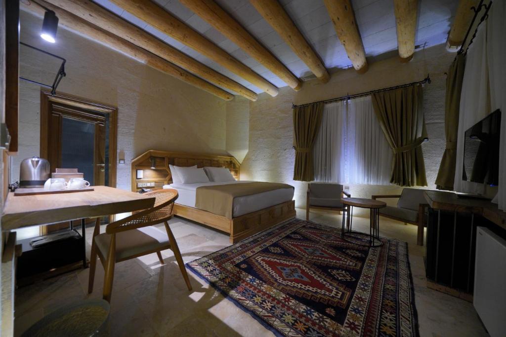 Postel nebo postele na pokoji v ubytování Kappadoks Cave Hotel