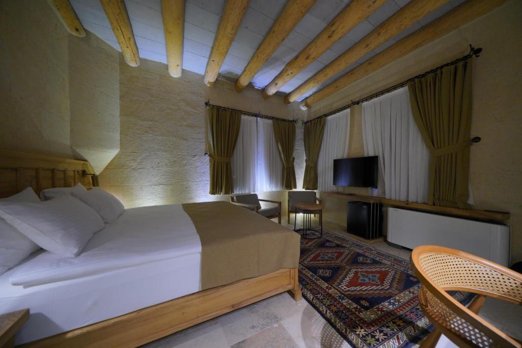 TV a/nebo společenská místnost v ubytování Kappadoks Cave Hotel
