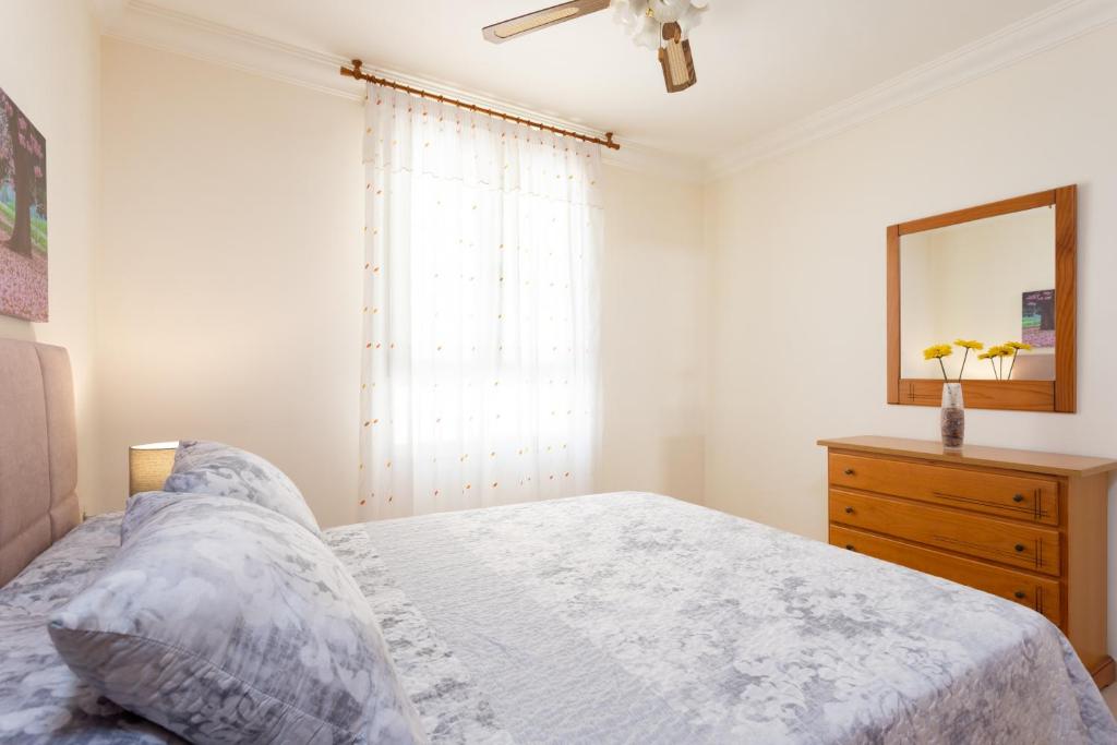 Postel nebo postele na pokoji v ubytování Apartment El Faro