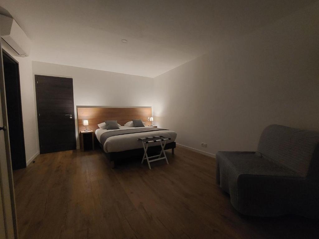 Łóżko lub łóżka w pokoju w obiekcie Les Lodges du Revermont