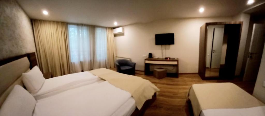 Postel nebo postele na pokoji v ubytování Hotel Lile