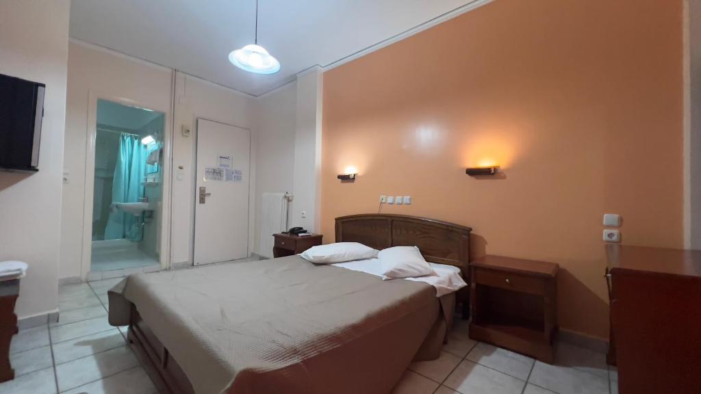Postel nebo postele na pokoji v ubytování Hotel Cosmos