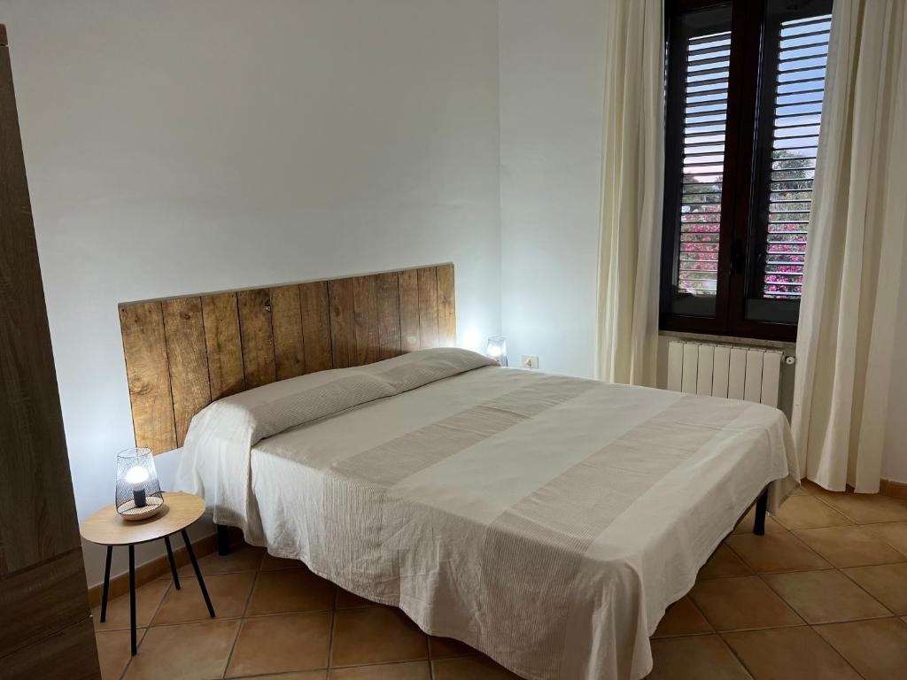 Postel nebo postele na pokoji v ubytování Villa con piscina TERRAZZA DAL PICCIOTTO