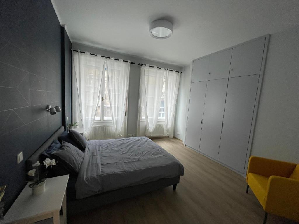 Posteľ alebo postele v izbe v ubytovaní Astoria Downtown Superior