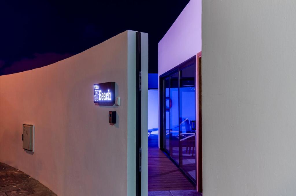 A television and/or entertainment centre at Villa JJ Beach by Villa Plus