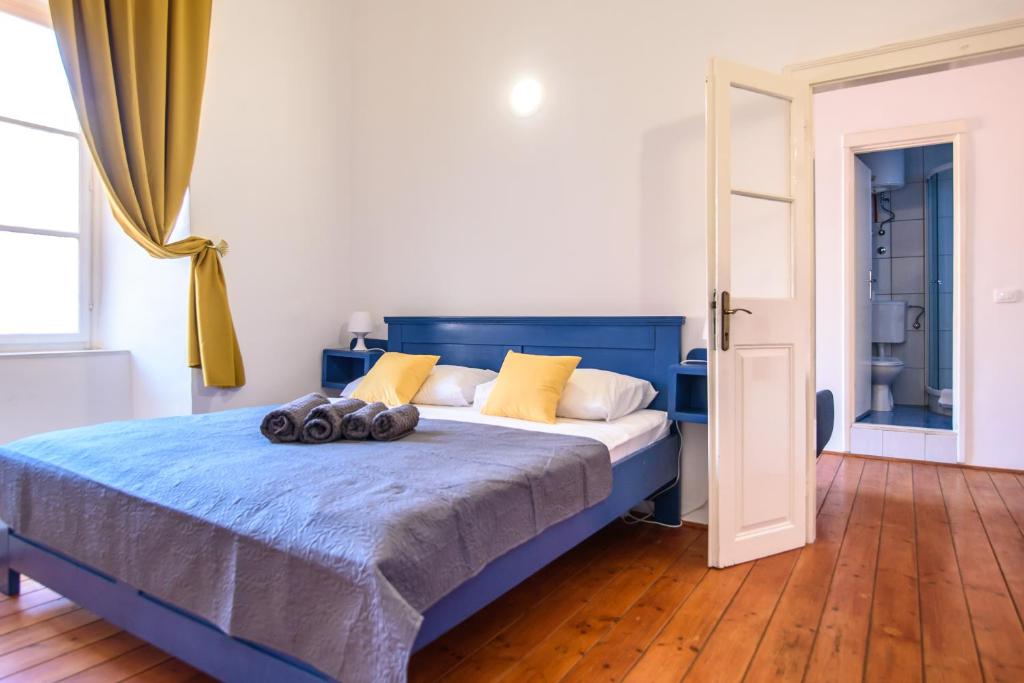 Posteľ alebo postele v izbe v ubytovaní LE MURA OLD TOWN APARTMENT by DuHomes