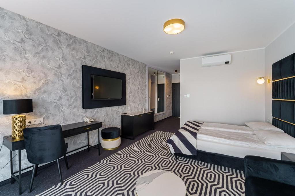 Postel nebo postele na pokoji v ubytování Hotel Solny