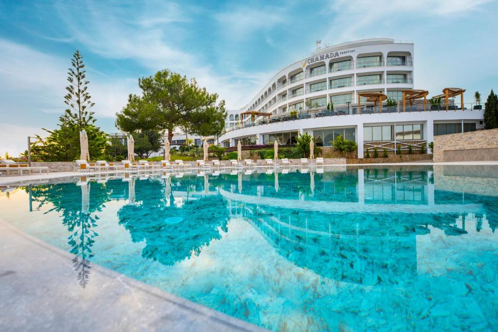 a large swimming pool in front of a building at Chamada Prestige Hotel and Casino in Kyrenia