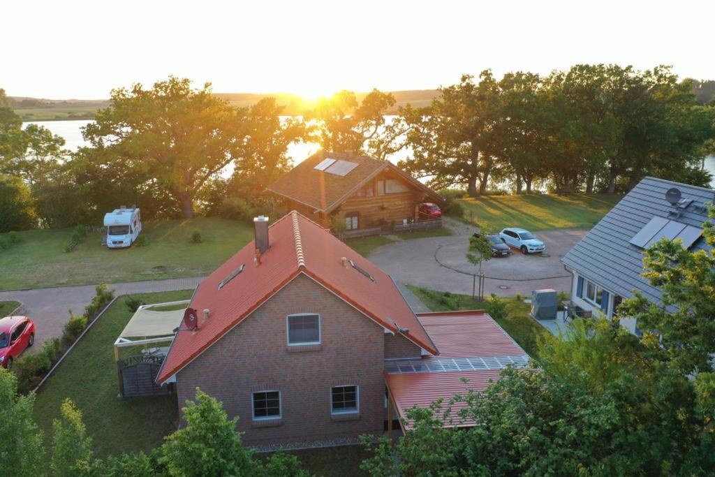 an aerial view of a house with a yard and a car at MaiStern in Sternberg