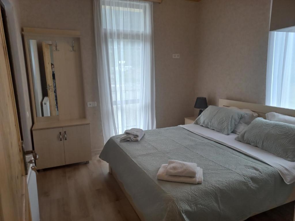 Postel nebo postele na pokoji v ubytování Hotel Marliza
