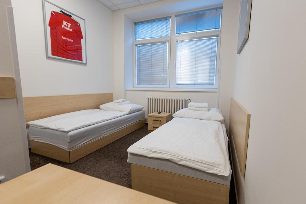 Postel nebo postele na pokoji v ubytování Arena Apartments