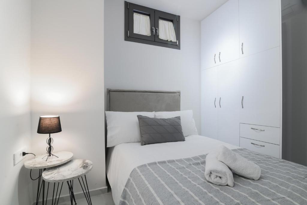Postel nebo postele na pokoji v ubytování Centro Studios & Apartments