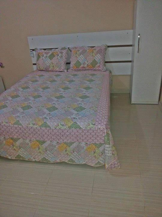 מיטה או מיטות בחדר ב-JR POUSADA