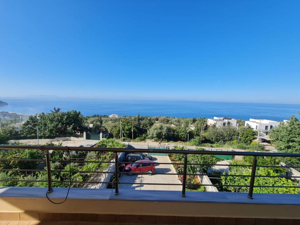 a balcony with a view of a parking lot at Dhori House Dhermi in Dhërmi