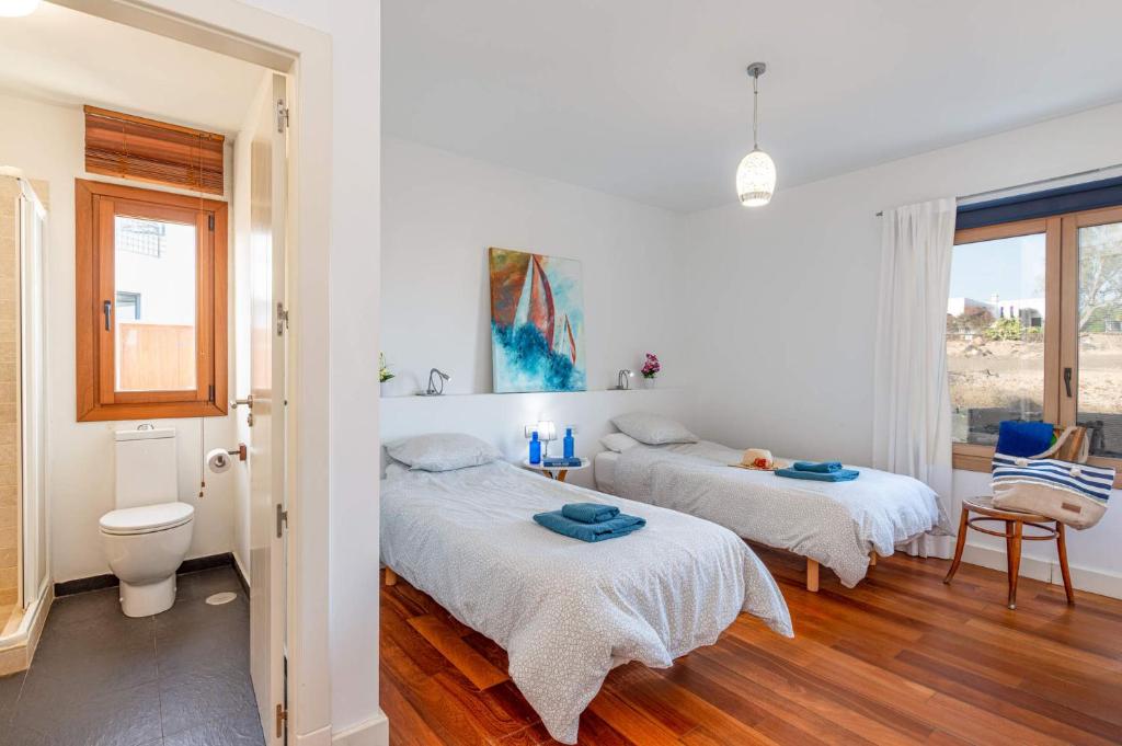 A bed or beds in a room at Villa Inma Calero by Villa Plus