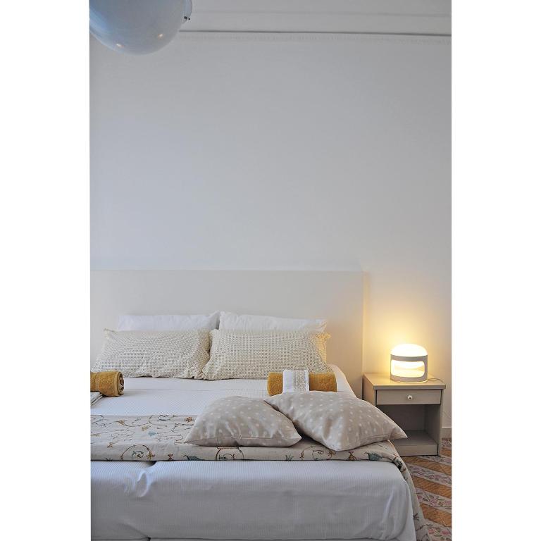 Postel nebo postele na pokoji v ubytování Agorà b&b