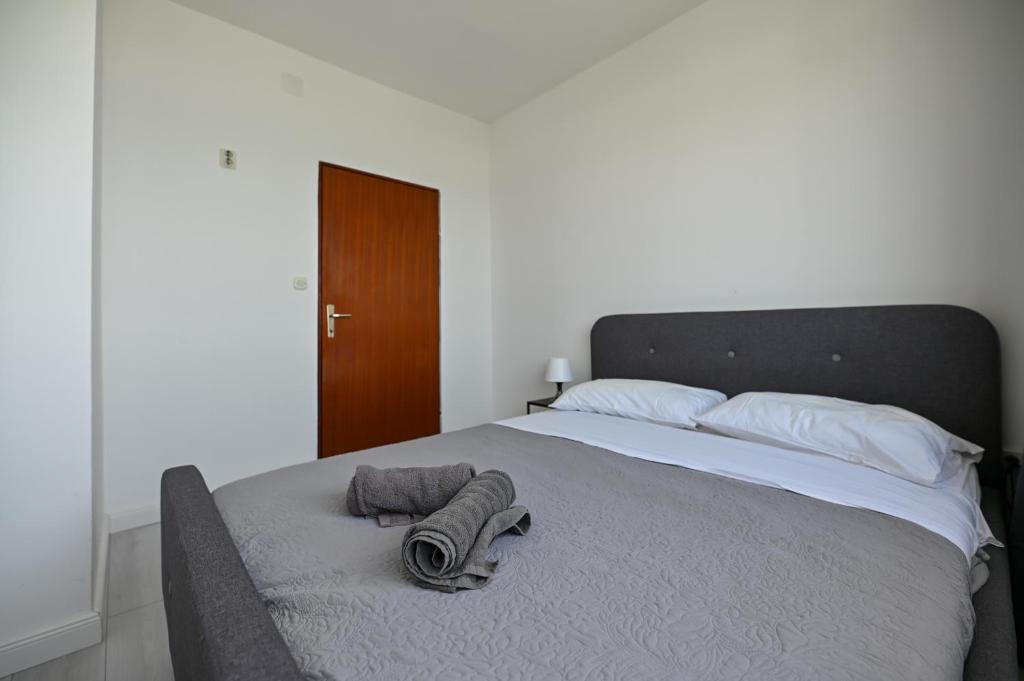 Postel nebo postele na pokoji v ubytování Apartmani Frleta