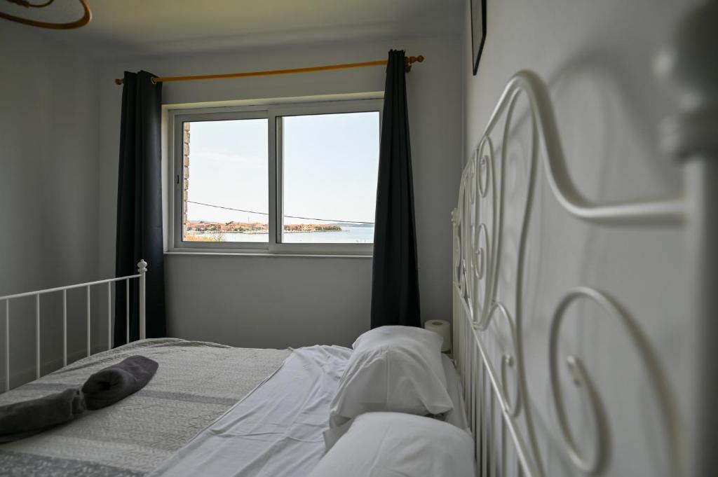 Postel nebo postele na pokoji v ubytování Apartmani Frleta
