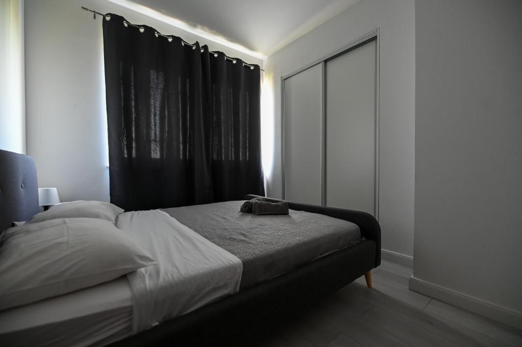 Postel nebo postele na pokoji v ubytování Apartmani Frleta