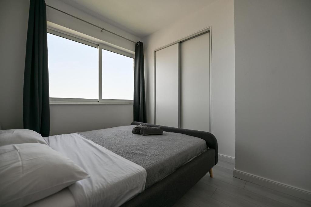 Postel nebo postele na pokoji v ubytování Apartmani Frleta