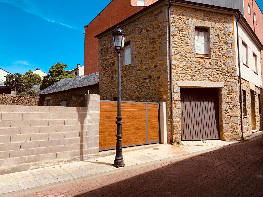 a street light in front of a brick building at Casa de la Abuela in Fabero