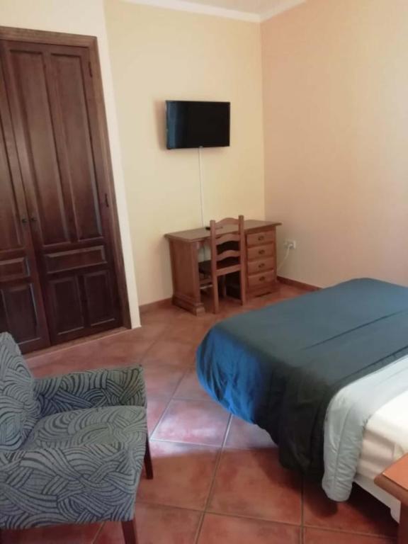 Postel nebo postele na pokoji v ubytování Hotel Plateros
