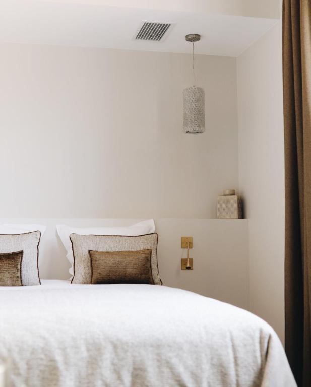 Postel nebo postele na pokoji v ubytování Hotel San Carlu Citadelle Ajaccio