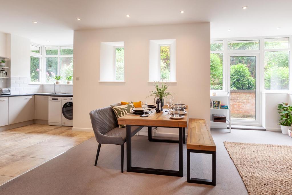 a kitchen and dining room with a table and chairs at No 5 Highwayman - Norfolk Cottage Agency in Sheringham