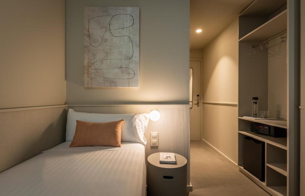 Postel nebo postele na pokoji v ubytování BYPILLOW The Bloom