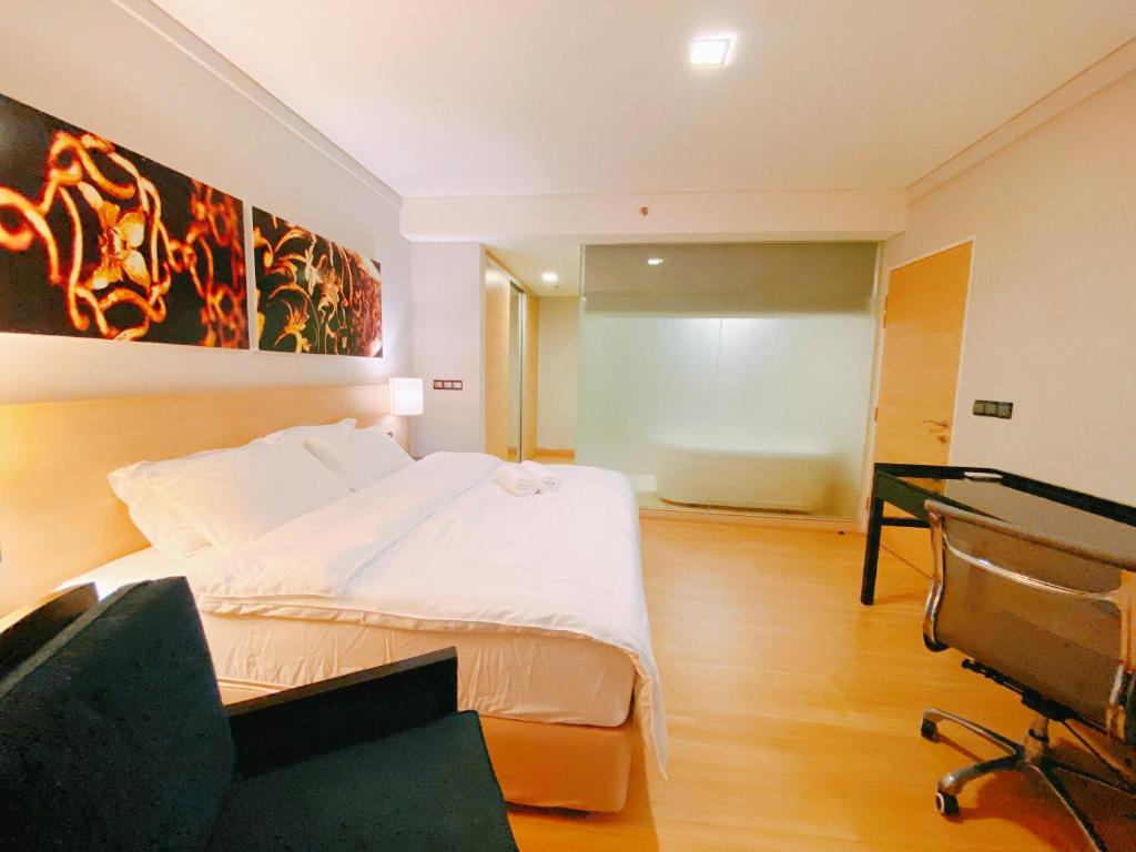 Postel nebo postele na pokoji v ubytování Straits Suite by C Homestay Malacca