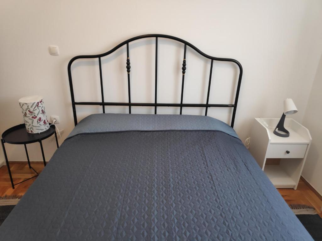 Postel nebo postele na pokoji v ubytování Apartman Ema