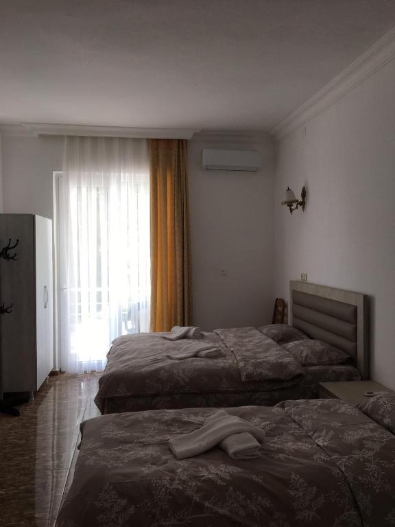 Postel nebo postele na pokoji v ubytování Rezo's House