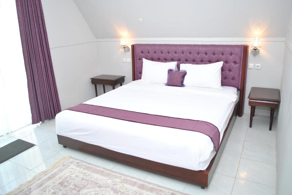 Postel nebo postele na pokoji v ubytování Seaside Villa & Muse Beach Resto