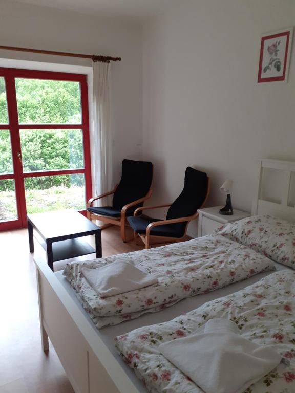 Postel nebo postele na pokoji v ubytování Apartmány Na samotě