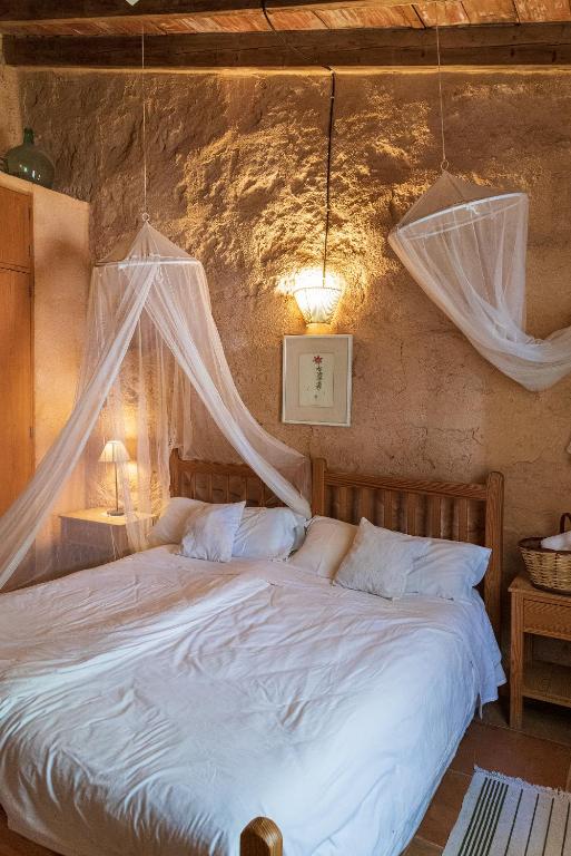 Postel nebo postele na pokoji v ubytování Sa Casa Rotja
