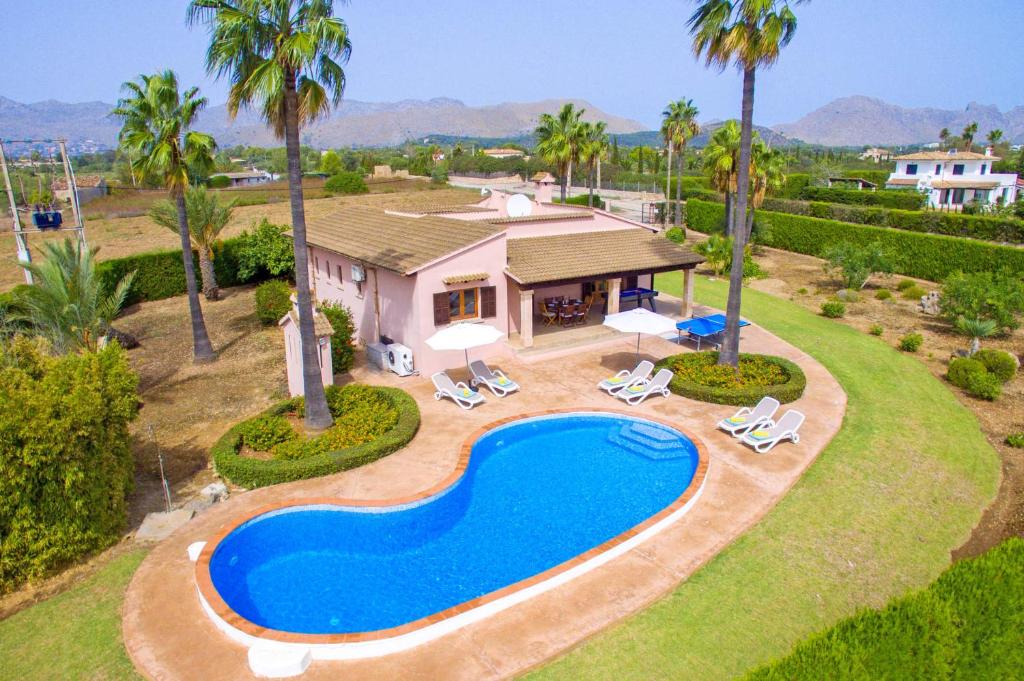 an aerial view of a house with a swimming pool at Villa Bauza by Villa Plus in El Port