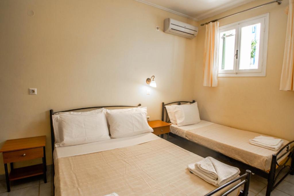 Ένα ή περισσότερα κρεβάτια σε δωμάτιο στο Phevos Villa