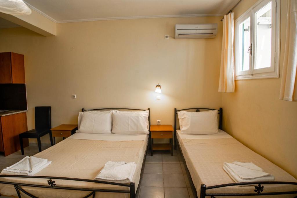 Ένα ή περισσότερα κρεβάτια σε δωμάτιο στο Phevos Villa
