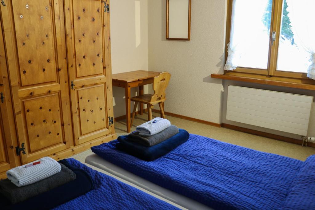 Postel nebo postele na pokoji v ubytování Chesa Dominium