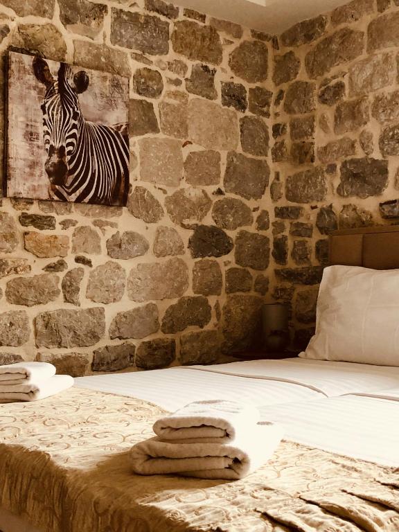 Postel nebo postele na pokoji v ubytování Guesthouse Giraffe