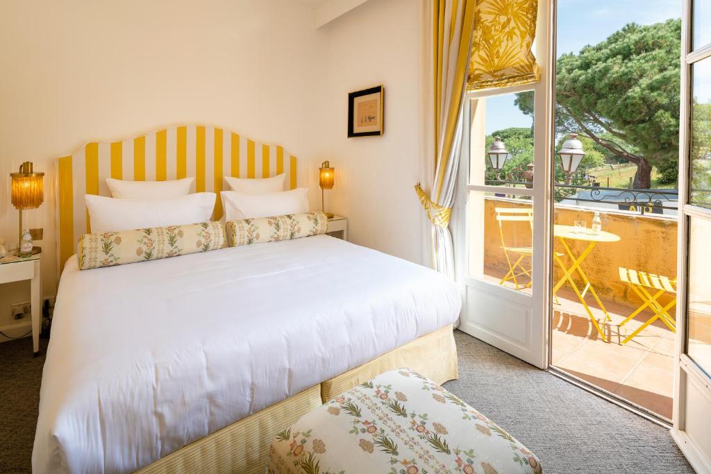 Postel nebo postele na pokoji v ubytování Hôtel Le Y