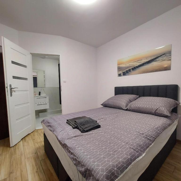 Posteľ alebo postele v izbe v ubytovaní Apartament MIRA