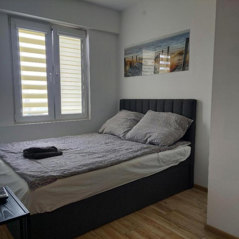 Posteľ alebo postele v izbe v ubytovaní Apartament MIRA