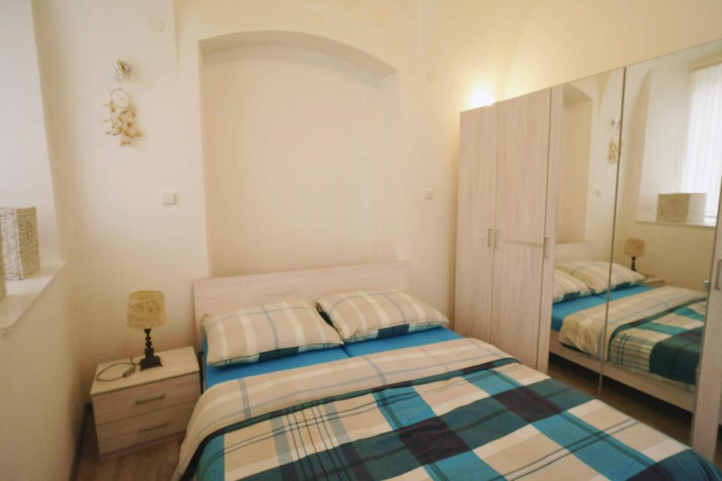 Postel nebo postele na pokoji v ubytování Apartmán U kostela
